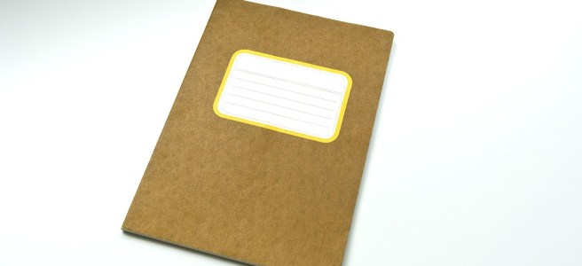 a buff cardboard covered exercise book, sometimes called a jotter